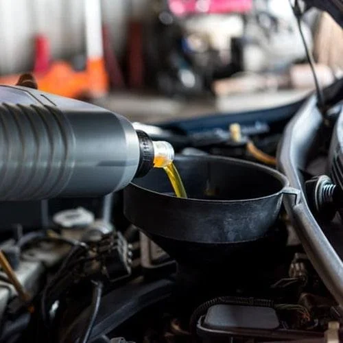 Engine oil being filled into a Volkswagen engine with the approved oil for that engine