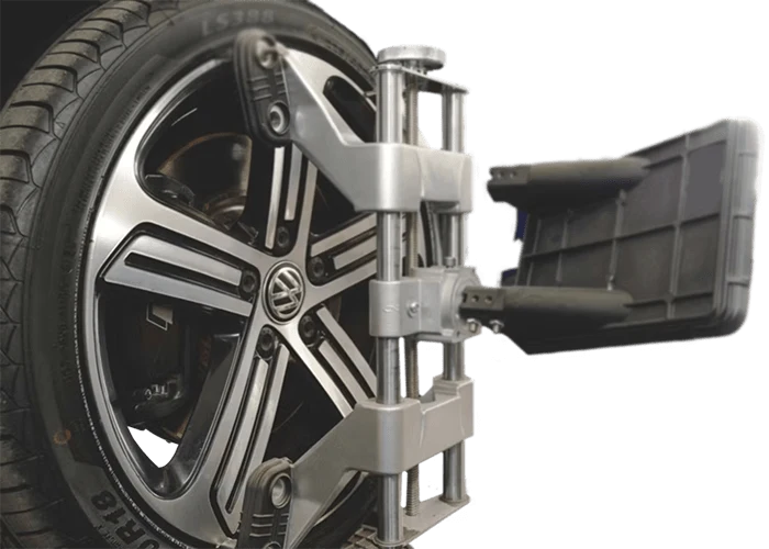 Reference photograph of wheel alignment equipment on a vehicle