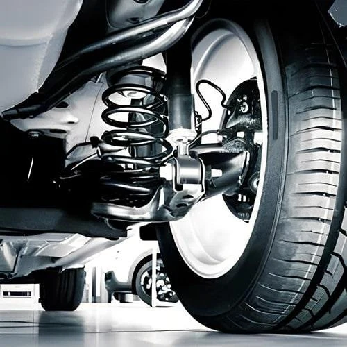 Reference view of a coil spring, damper and wheel suspension