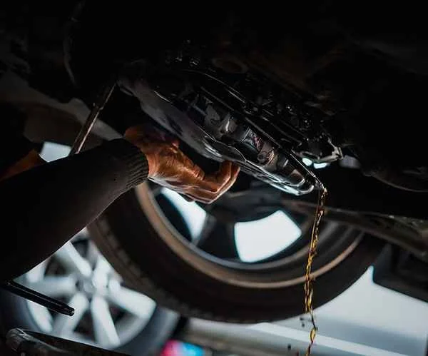 Fluid draining beneath a vehicle during transmission work