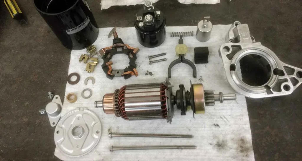 Starter motor armature, brushes and housing